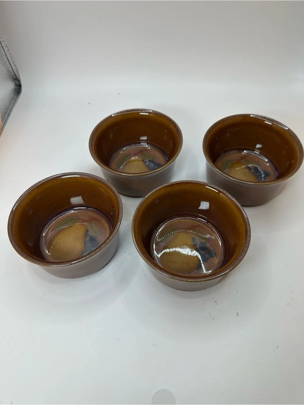 Set of 4 Denby Orchard Stoneware Ramekins feature a glossy brown Glaze.